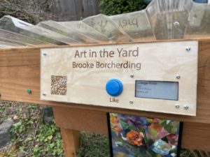 Art in the Yard sign with physical like button